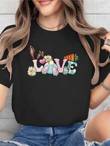 The Word LOVE Formed With Rabbit Ears, Flowers, Daisies, Carrots, Hearts, And Paw Prints Conveys Tenderness, Joy, And A Sweet Spirit. A Comfortable, Casual Women's T-Shirt For Everyday Wear. - 黑色 - 查看 8