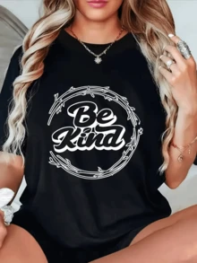 Positive Message That Inspires Empathy Within A Decorative Circle Of Branches That Symbolizes Inner Harmony And The Strength Of Kindness. Women's T-Shirt With A Modern And Comfortable Print For Everyday Wear. - Black - View 1