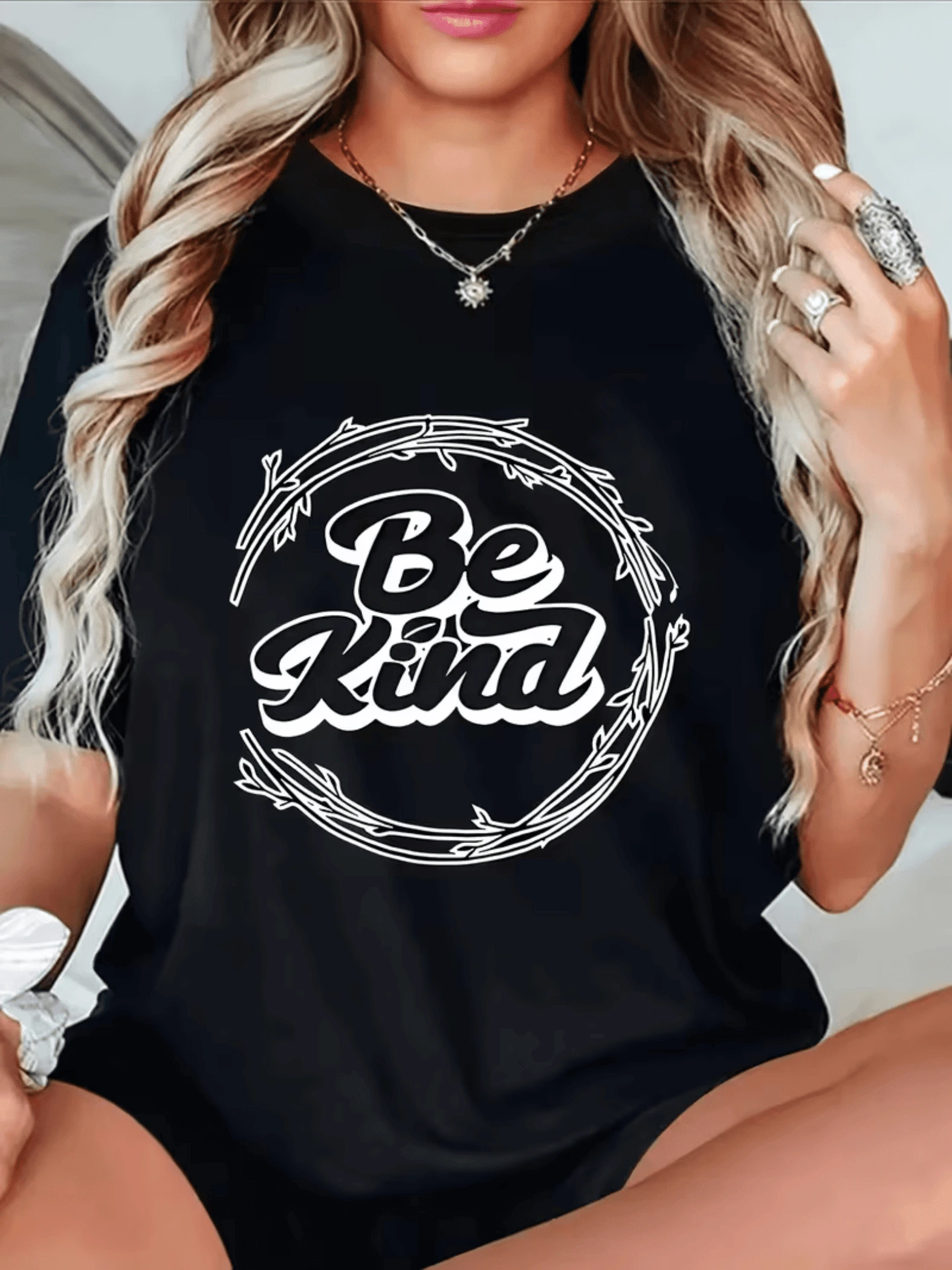 Positive Message That Inspires Empathy Within A Decorative Circle Of Branches That Symbolizes Inner Harmony And The Strength Of Kindness. Women's T-Shirt With A Modern And Comfortable Print For Everyday Wear. - Black - View 1