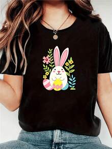 A White Bunny Surrounded By Colorful Flowers And Decorated Eggs Symbolizes Joy, Renewal, And Tenderness-Perfect For Expressing An Optimistic Spirit. A Comfortable, Casual Women's T-Shirt For Everyday Wear. - 黑色 - 查看 8