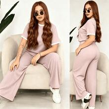 Comfort And Style In One Outfit! Upgrade Your Look With Our 2-Piece Set: A Ribbed Top And Super Comfortable Pants. Available In Various Colors. Women's 2-Piece Casual Set: Short-Sleeve Crew Neck Top And High-Waisted Loose Wide-Leg Pants - Ribbed Textured Loungewear Set For Summer And Yoga - Pink - View 2