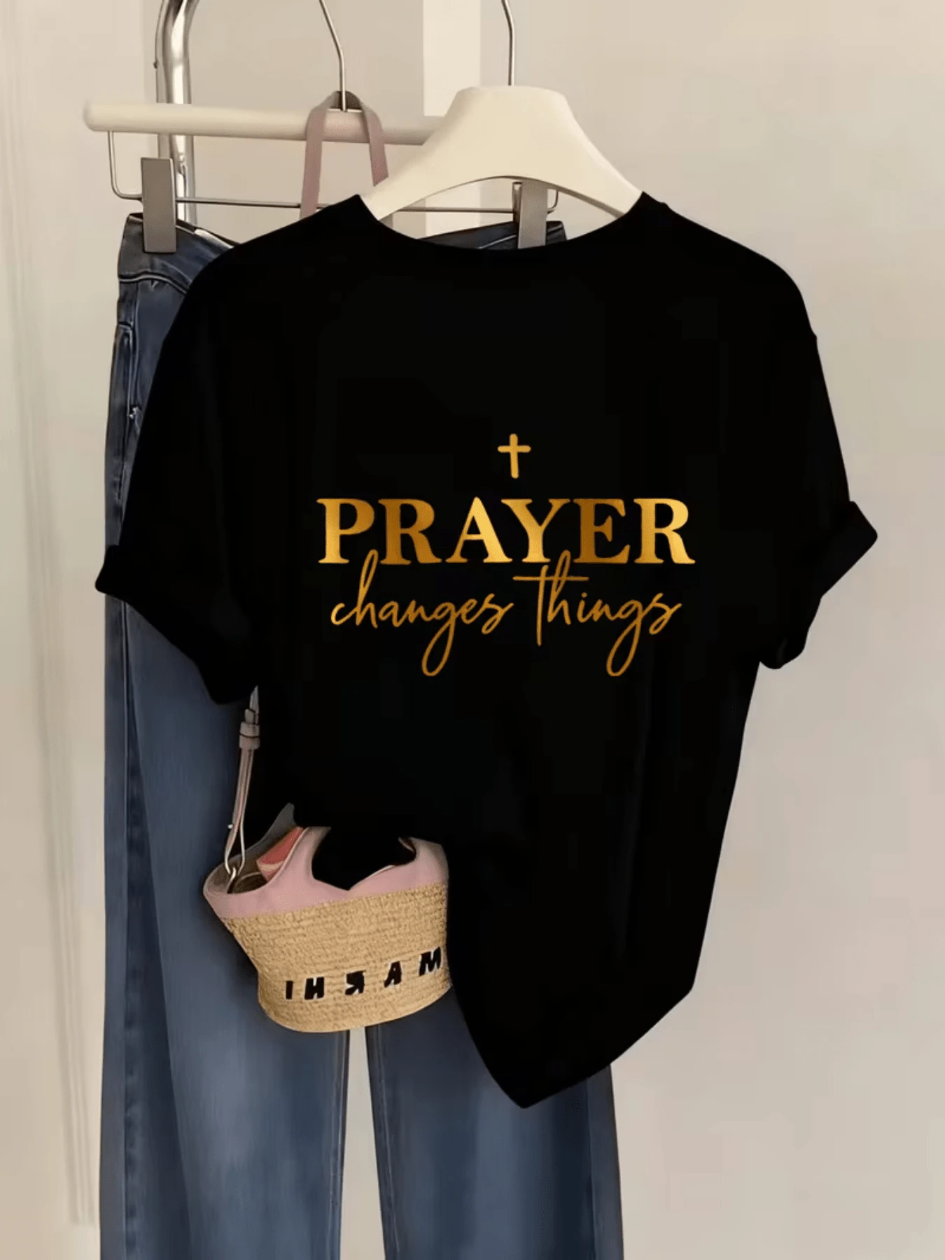 An Inspiring Message In Gold Lettering Conveys Faith, Hope, And Inner Strength, Reminding Us That Prayer Transforms Life And Strengthens The Spirit. A Modern, Casual, And Comfortable Women's T-Shirt For Everyday Wear. - Black - View 1