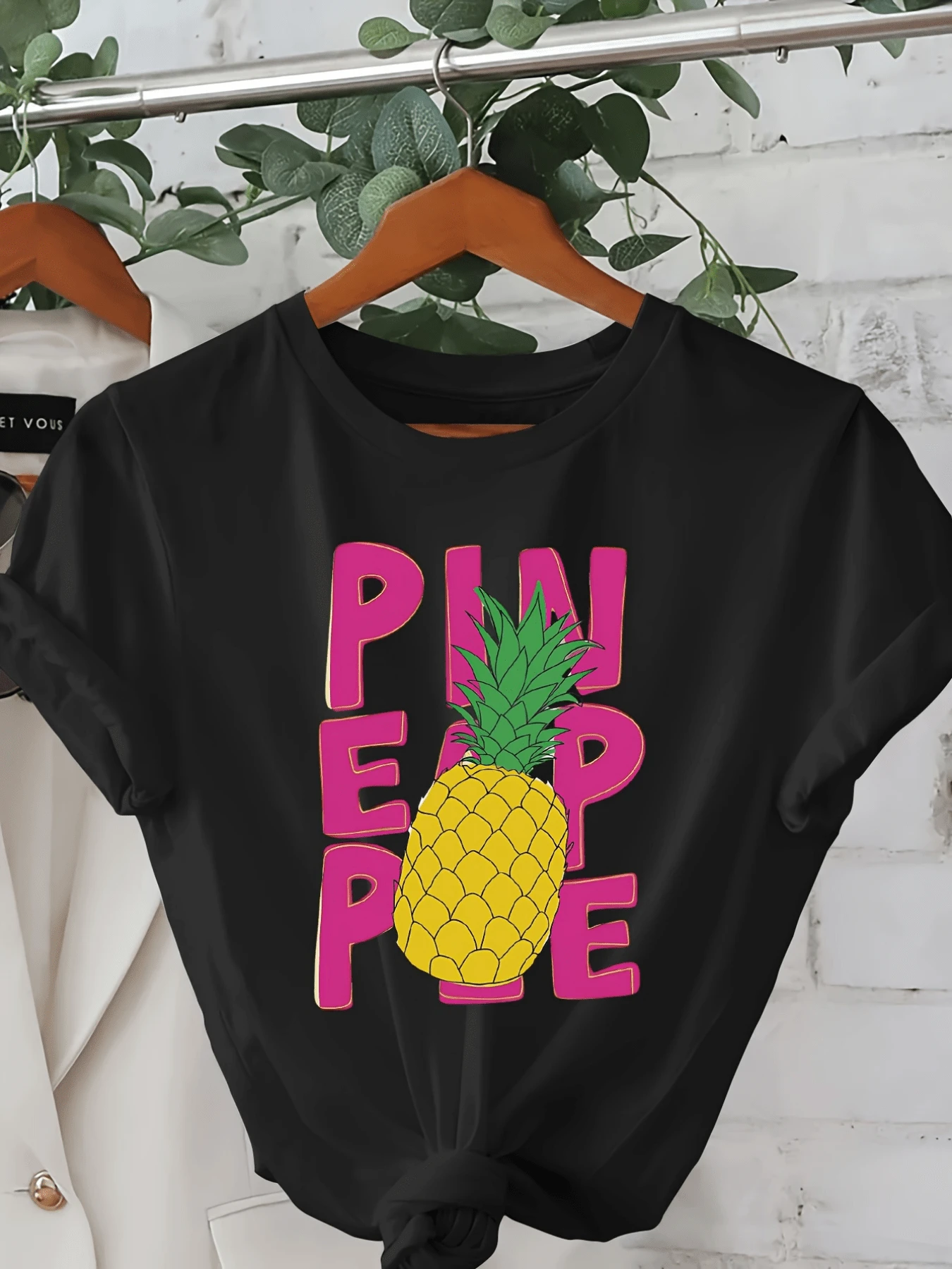 Yellow Pineapple With Green Leaves Symbolizing Energy, Optimism And Tropical Freshness On Vibrant Pink Lettering. Modern Casual Comfortable Women's T-Shirt For Summer. - Black - View 1