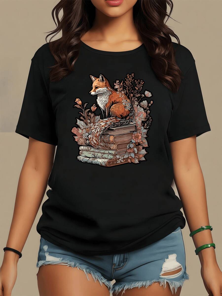 A Fox Resting On Antique Books Surrounded By Flowers Symbolizes Wisdom, Nature, And Inner Calm, Combining Mystical Essence And Artistic Serenity. This Comfortable, Casual Women's T-Shirt Is Ideal For Everyday Wear. - 黑色 - 查看 1