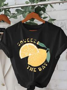 Half A Bright Lemon With Green Leaves Symbolizing Energy, Optimism, And Freshness, Inviting You To Seize Each Day With Joy. A Modern, Comfortable, Casual Women's T-Shirt For Everyday Wear. - 黑色 - 查看 1