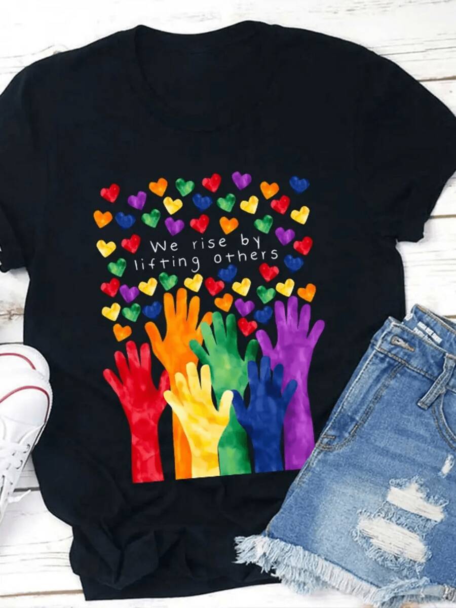 Women's Inspirational T-Shirt 'We Rise To Lift Others' - Soft Crew Neck Short Sleeve T-Shirt With Colorful Hands And Hearts Design, Vibrant And Multicolored, Suitable For Casual Wear, From Uste Hoado (See Size Chart), Machine Washable Statement Garment - Black - View 1