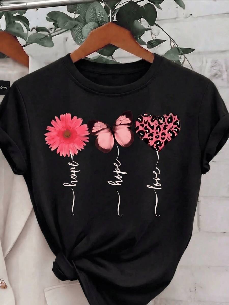 Flor rosada que simboliza la esperanza junto a una mariposa que representa la transformación y un corazón con estampado animal que expresa amor y fuerza camiseta de mujer casual cómoda y moderna - Negro - Ver 1