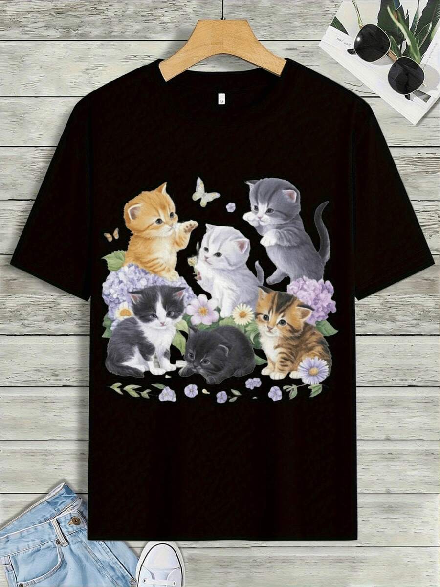 Camiseta con Gráfico de Gaos Adorables - Adorable Camiseta Negra con Seis Gaos Juguetones en Varios Colores, rodeados de Flores Coloridas, Perfectara Amantes de los Gatos y Ropa Casual. Diseño Encdor con Deta en larte Inferior