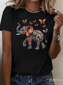 Elefante colorido adornado con flores y mariposas simboliza fuerza ternura transformación libertad espiritual y conexión con la naturaleza camiseta de mujer casual cómoda para uso diario - Negro - Ver 1