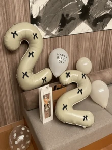 1套大號奶油白色數字氣球套組，含1個「0-9」數字生日氣球與5個黑色緞面蝴蝶結，適用於生日派對、婚禮、週年紀念、新年、節慶、開學季及其他場合 - 乳白色 - 查看 6