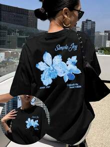 A Short-Sleeved T-Shirt With Front And Back Floral Prints, Featuring A Easy And Cheerful Design With Blue Flower Patterns, Perfect For Casual Wear In Spring And Summer - Black - View 1
