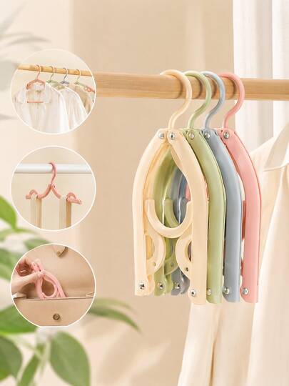 12 chiếc móc treo quần áo gấp gọn đa năng, tiện dụng cho người đi du lịch và công tác.