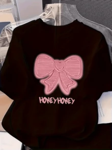 Gran lazo rosado con forma de corazón en el centro representa dulzura y ternura con palabras HONEY HONEY que evocan cari?o y energía positiva camiseta de mujer manga corta casual moderna para uso diario - Negro - Ver 1