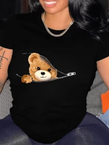 A Cute Teddy Bear Peeking Out From Behind An Open Zipper Symbolizes The Sweetness Hidden In The Feminine Heart And Conveys A Feeling Of Tenderness And Everyday Joy. A Comfortable And Modern Casual Women's T-Shirt For Everyday Wear. - 黑色 - 查看 1