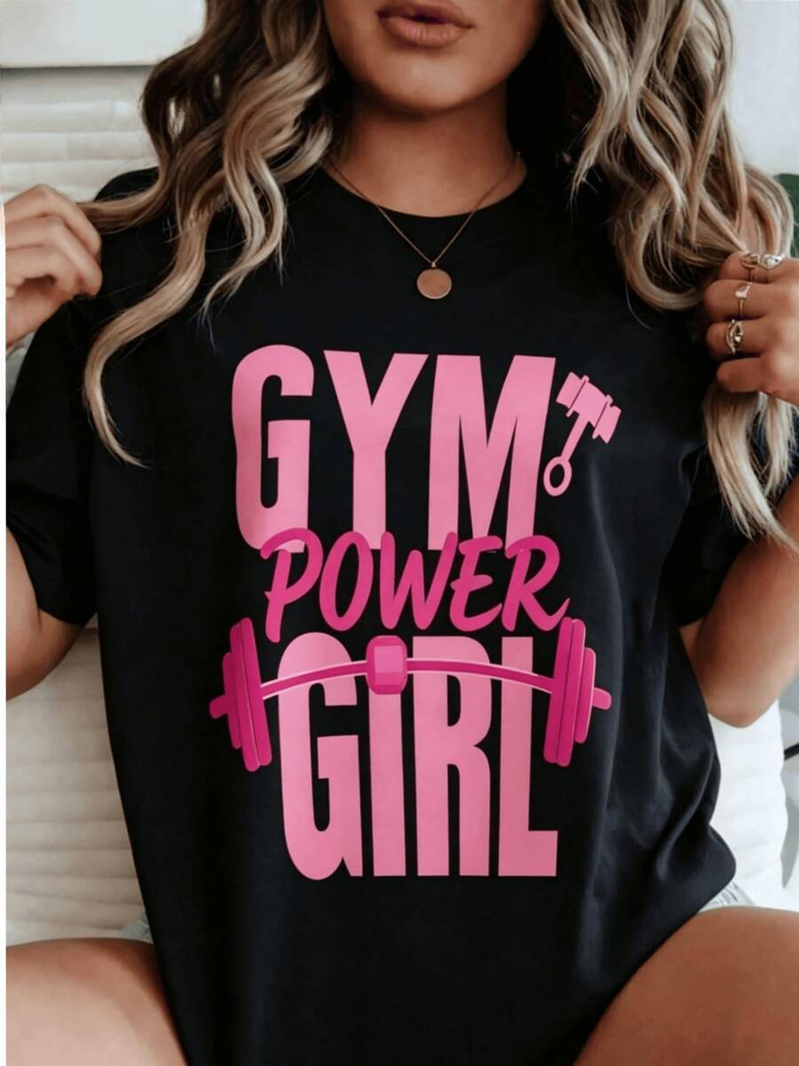 Frase motivadora que representa fortaleza femenina y pasión por el entrenamiento con ilustración de pesas rosadas símbolo de energía y confianza camiseta de mujer moderna ideal para gimnasio - Negro - Ver 1