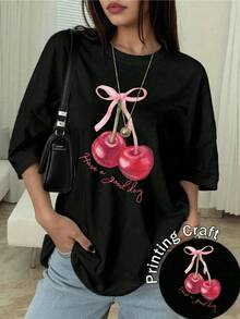 Two Bright Cherries Joined By A Pink Ribbon Convey Tenderness And Positive Energy, Inviting You To Enjoy Each Day With Joy And Confidence. A Modern, Comfortable, Casual Women's T-Shirt For Everyday Wear. - 黑色 - 查看 1