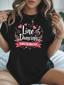 Notas musicales rodeadas de corazones y flores rosadas que expresan alegría y energía positiva celebrando la diversión del baile en línea camiseta de mujer cómoda y moderna para uso casual - Negro - Ver 1