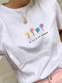 Cuatro flores de colores que simbolizan la alegría la vitalidad y la conexión con la luz del sol transmitiendo energía positiva camiseta de mujer casual moderna y cómoda para uso diario - Blanco - Ver 1