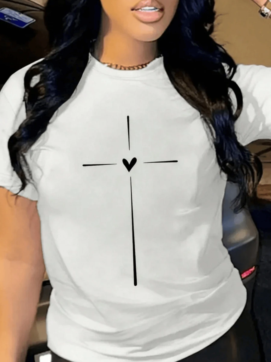 Cruz blanca con un corazón al centro que representa amor fe y esperanza en equilibrio perfecto sobre fondo oscuro camiseta de mujer casual moderna para uso diario cómoda y con mensaje positivo - Blanco - Ver 1