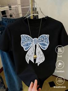 Gran lazo brillante bordado con cuentas azules y plateadas que simboliza elegancia y pureza reflejando una combinación delicada de luz y calma camiseta de mujer casual cómoda y transpirable - Negro - Ver 8