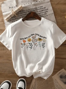 Flores coloridas que simbolizan el crecimiento la ternura y el amor hacia los demás formando un jardín lleno de vida y esperanza camiseta de mujer - Blanco - Ver 1
