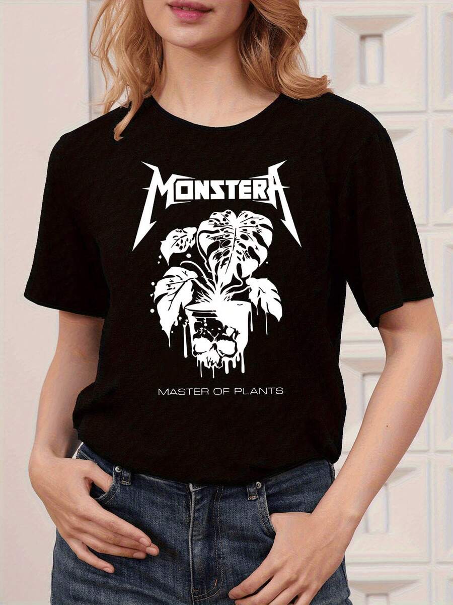 Hoja de monstera que simboliza la fuerza salvaje de la naturaleza con gotas que parecen fusionar vida y misterio coronada por una calavera que refleja el poder oculto de las plantas camiseta de mujer moderna casual elegante y cómoda - Negro - Ver 1