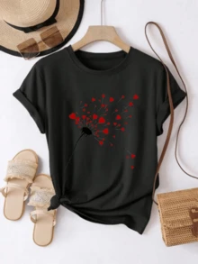 Red Hearts Blooming Like Petals In The Wind, Symbolizing The Freedom To Love And Inner Joy. A Modern And Comfortable Casual Women's T-Shirt For Everyday Wear. - 黑色 - 查看 1