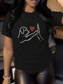 A Sweet Drawing Showing A Dog Touching A Human Hand With A Red Heart Symbolizing Love, Loyalty, And The Bond Between Pet And Person. A Comfortable, Casual Women's T-Shirt, Ideal For Everyday Wear. - 黑色 - 查看 1