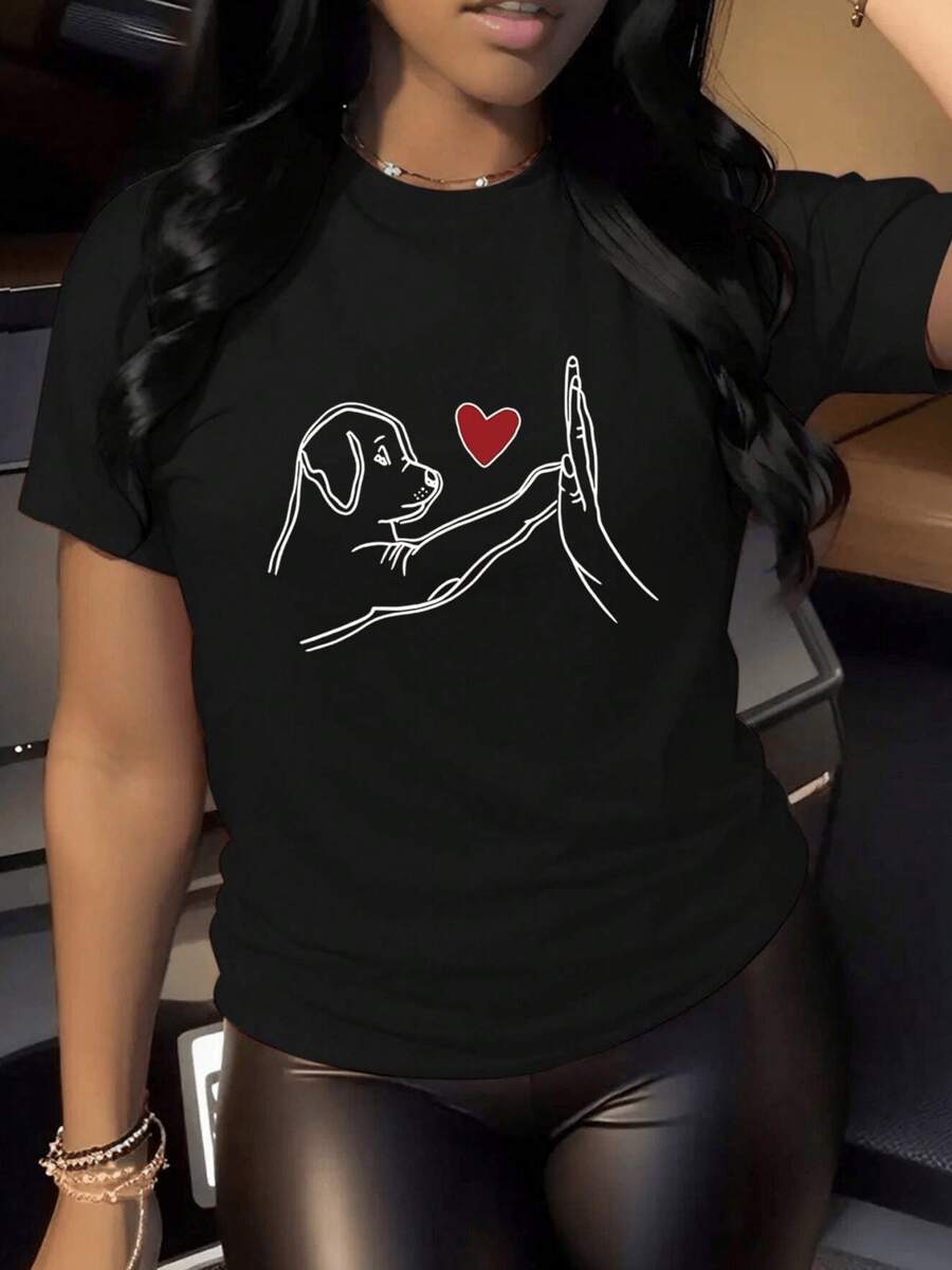 A Sweet Drawing Showing A Dog Touching A Human Hand With A Red Heart Symbolizing Love, Loyalty, And The Bond Between Pet And Person. A Comfortable, Casual Women's T-Shirt, Ideal For Everyday Wear. - 黑色 - 查看 1