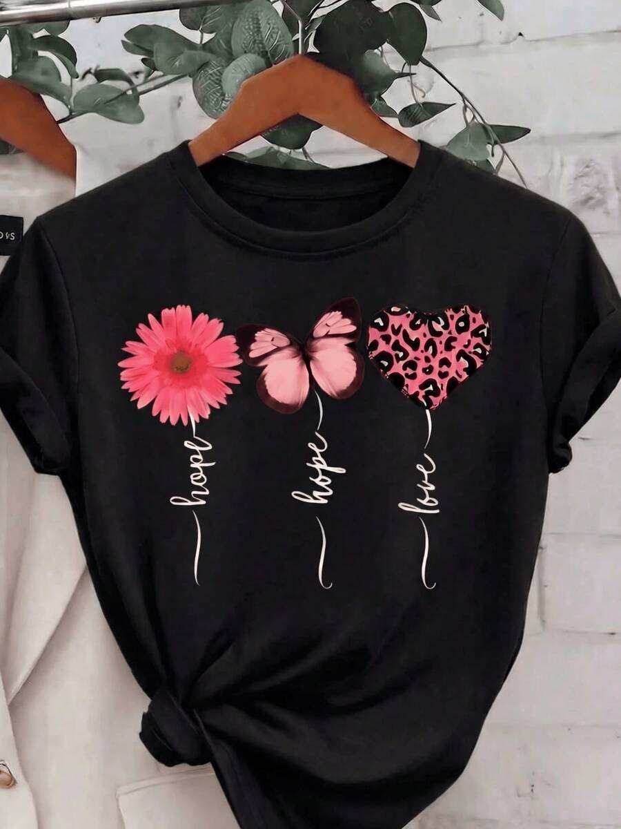 Pink Flower, Butterfly, And Heart With A Wild Pattern Symbolize Hope, Love, And Inner Strength, Expressing Vital Joy And Positive Energy. A Comfortable, Modern, Casual Women's T-Shirt For Everyday Wear. - 黑色 - 查看 1