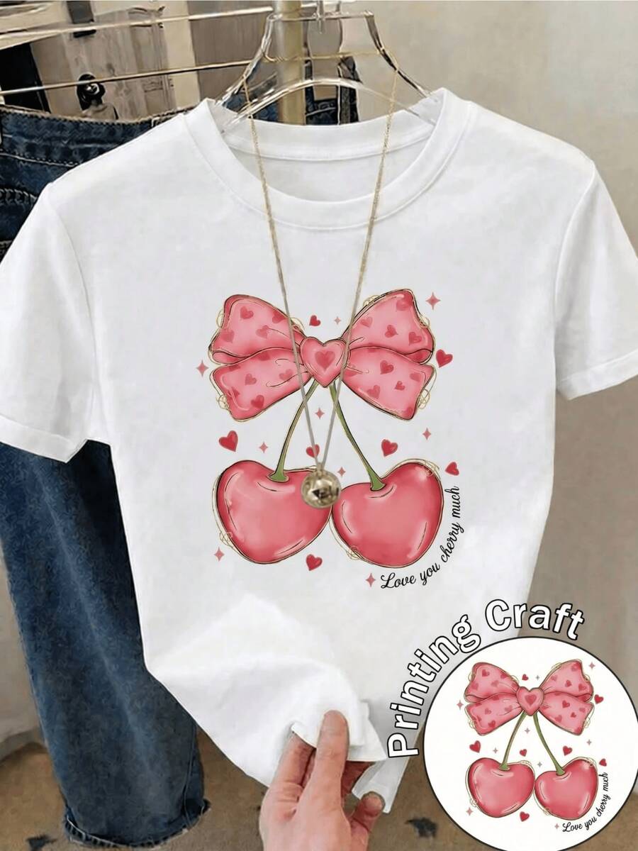 Two Cherries Joined By A Large Pink Bow With Hearts Symbolize Sweetness, Romantic Love, And The Joyful Union Of Summer-Ideal For Conveying Tenderness And Positive Energy. A Modern, Casual Women's T-Shirt. - 白色 - 查看 1