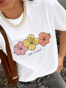 Three Tropical Flowers In Shades Of Pink, Yellow, And Orange Reflect Joy, Vitality, And Positive Energy, Conveying An Optimistic Message Of Love For Life. This Comfortable, Casual Women's T-Shirt Is Perfect For Everyday Wear. - 白色 - 查看 1