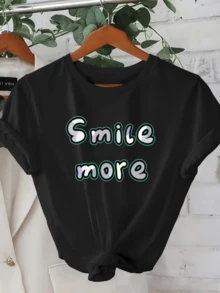 A Positive Message That Encourages You To Smile More, Conveying Joy And Optimistic Energy With Colorful Lettering That Inspires Good Spirits. Ideal For Casual Wear, This Comfortable And Modern Women's T-Shirt Is Perfect For Everyday Wear. - 黑色 - 查看 1