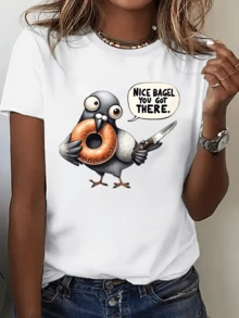 Cartoonish Dove Holding A Bagel And A Knife With A Funny Expression Conveying Urban Humor And Casual Style, Ideal For Relaxed Moments. Modern Women's T-Shirt For Everyday Wear. - 白色 - 查看 6
