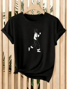 Figure Of A Person Walking With A Cup In Hand Representing Urban Calm And The Search For Personal Balance While Enjoying An Everyday Moment. Women's Casual Modern Comfortable T-Shirt For Daily Wear - 黑色 - 查看 1