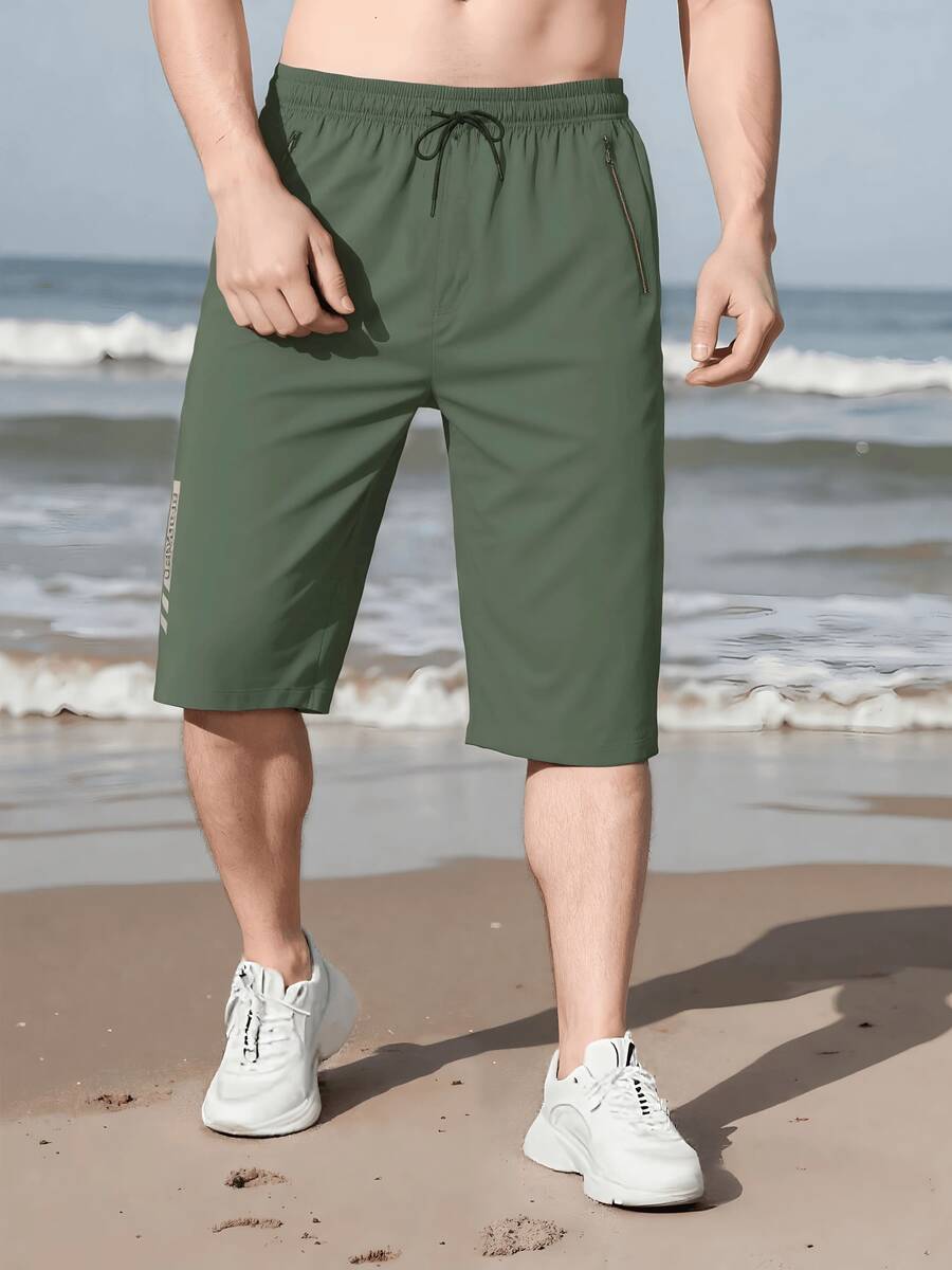 男士夏季休閒運動慢跑七分褲,附腰部抽繩與拉鍊口袋 - 軍綠色 - 查看 1
