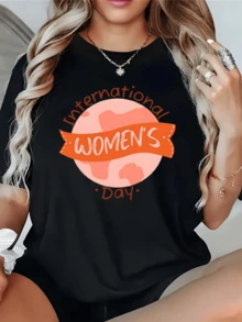A Pink Planet Symbolizing Unity And Feminine Strength, With A Ribbon Celebrating The Importance Of International Women's Day, Highlighting Positive Energy And The Pride Of Being A Woman. Comfortable Casual Women's T-Shirt For Everyday Wear. - 黑色 - 查看 1