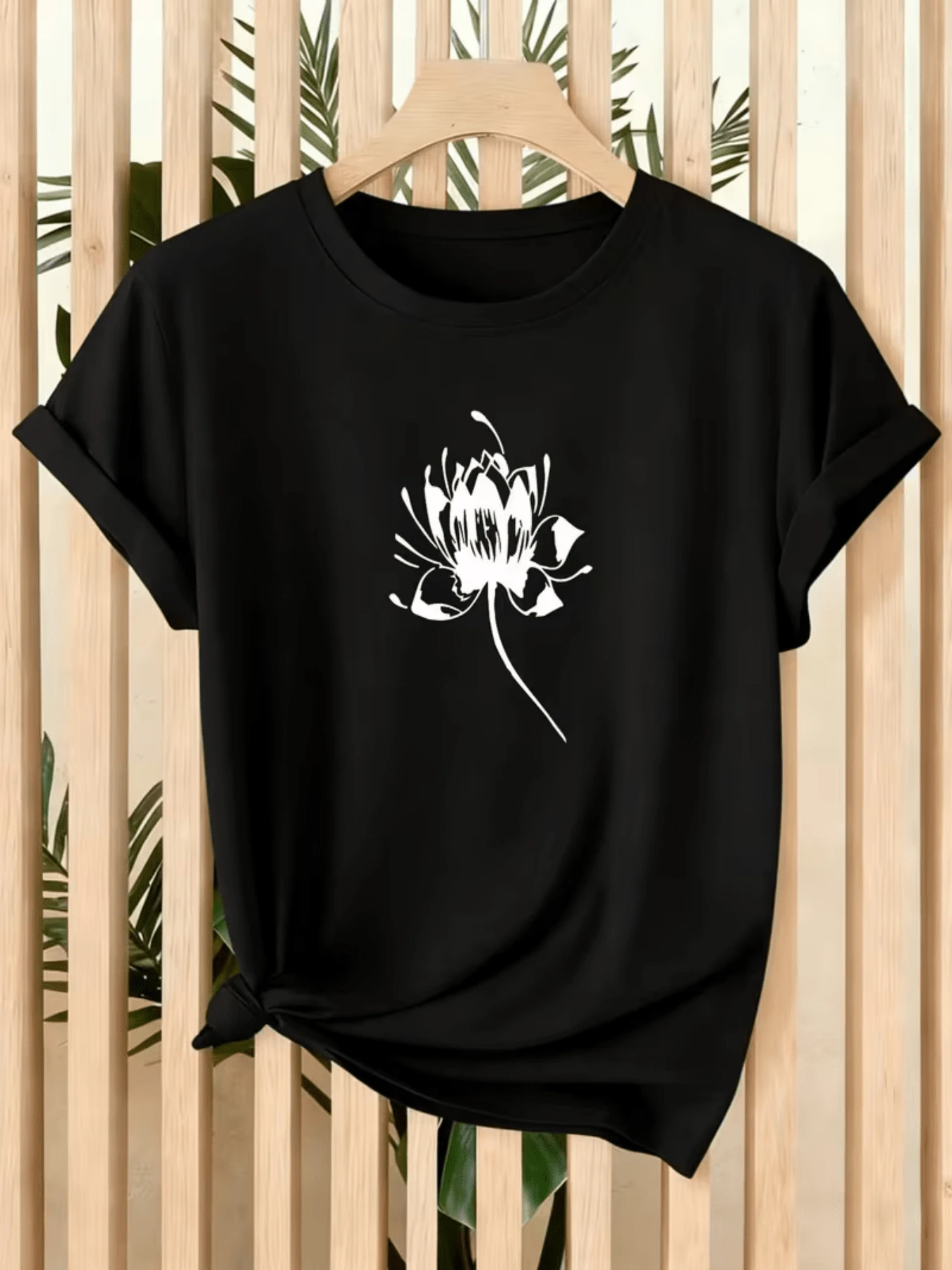 White Lotus Flower Symbolizing Purity, Serenity, And Inner Strength, Conveying Calm And Spiritual Balance. Women's Casual, Modern, Comfortable T-Shirt For Everyday Wear. - Black - View 1