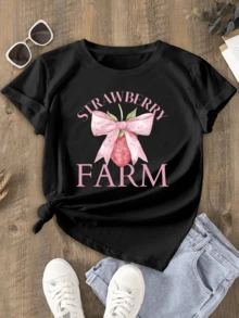 A Large Pink Strawberry With A Pastel Bow Symbolizes Natural Sweetness And Country Joy, Perfect For Sunny Days. A Comfortable, Modern Women's Casual T-Shirt. - 黑色 - 查看 1