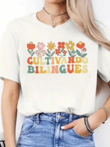 Colorful Flowers Symbolizing Growth, Joy, And Connection Between Cultures, Accompanied By Lettering That Inspires Education And Harmony. Comfortable, Casual Women's T-Shirt For Everyday Wear. - 白色 - 查看 8