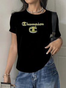 Text On The Chest With Large Letters Symbolizing Inner Strength And Self-Confidence Against A Dark Background Creating A Modern Contrast. Elegant Casual Women's T-Shirt For Everyday Wear. - Black - View 1