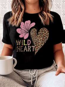 A Wild Heart Formed By A Leopard Print Alongside A Pink Flower Symbolizes Inner Strength And Feminine Sweetness, Showcasing Energy And Confidence In Every Detail. This Modern, Comfortable, Casual Women's T-Shirt Is Perfect For Everyday Wear. - 黑色 - 查看 1