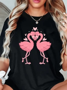 Two Pink Flamingos Gaze Tenderly At Each Other, Forming A Heart With Their Necks Surrounded By Tiny Hearts That Express Love, Unity, And Sweetness. Ideal For Conveying Romance And Joy. A Modern, Comfortable, Casual Women's T-Shirt For Everyday Wear. - 黑色 - 查看 1