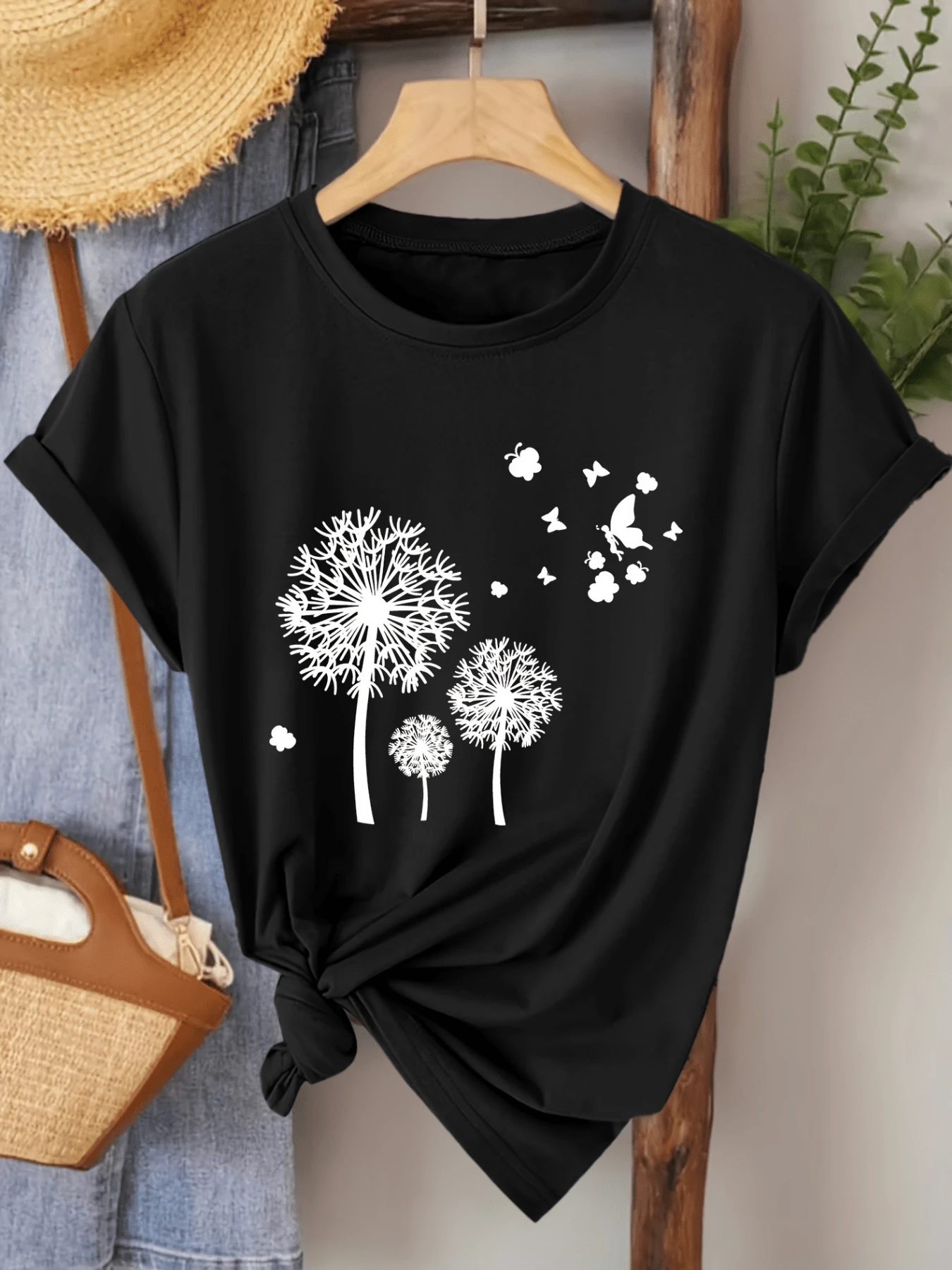 Flores de diente de león que se transforman en mariposas al viento simbolizando libertad esperanza y renovación camiseta de mujer casual cómoda para uso diario - Negro - Ver 1