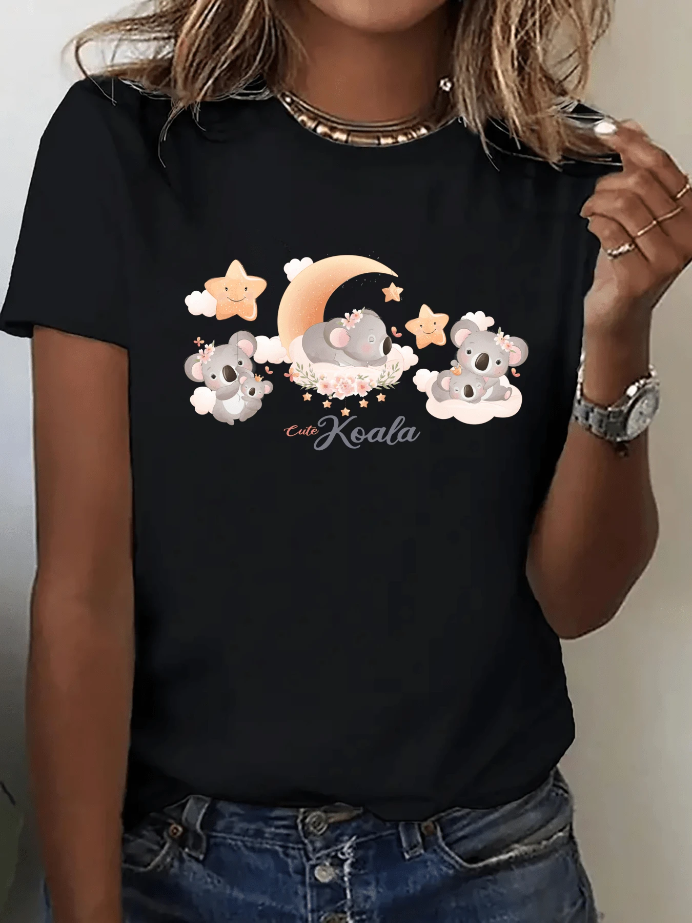 Koalas Sleeping On A Golden Moon Surrounded By Stars And Soft Clouds Convey Tenderness And Calm, Perfect For Those Who Love Animals And Dreams. This Casual Women's T-Shirt With A Charming Print Is Ideal For Everyday Wear. - 黑色 - 查看 1