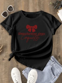 A Red Ribbon Symbolizes Feminine Charm And Confidence, Conveying A Flirty And Cheerful Spirit That Reflects Inner Beauty And Seductive Playfulness With An Elegant Touch. A Modern, Casual Women's T-Shirt For Everyday Wear. - 黑色 - 查看 1