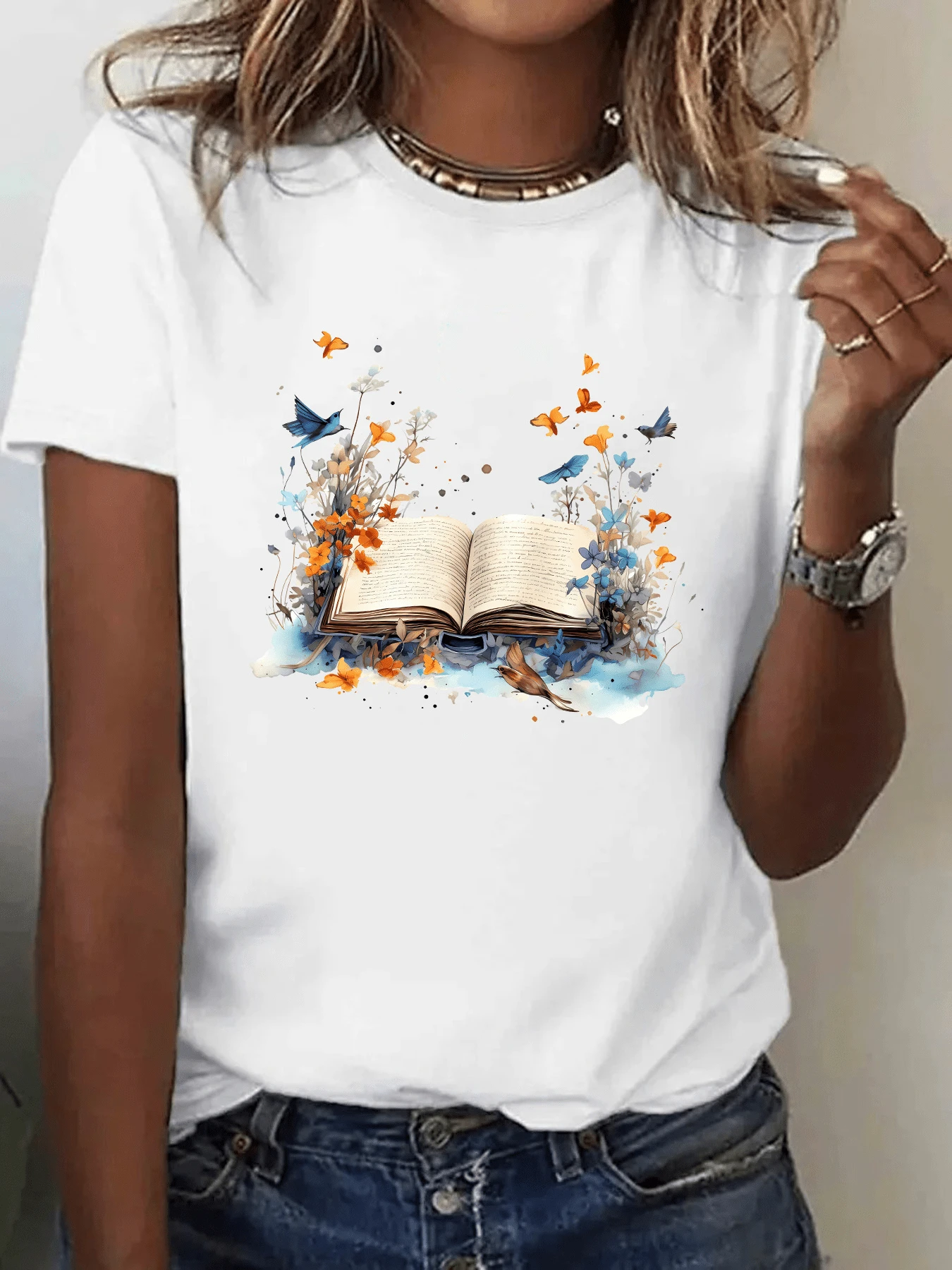 Open Book Surrounded By Orange And Blue Butterflies Emerging From Its Pages Alongside Luminous Flowers Symbolizing Freedom, Imagination, And The Blossoming Of Knowledge. Modern Casual Women's T-Shirt Perfect For Everyday Wear - 白色 - 查看 1