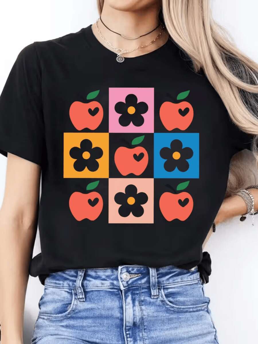 Manzanas rojas con corazones y flores negras en cuadros coloridos que evocan alegría energía y un estilo retro moderno para expresar vitalidad camiseta de mujer cómoda y casual - Negro - Ver 1