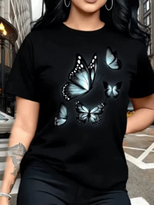 Mariposas luminosas que simbolizan libertad transformación y belleza interior con alas que parecen brillar en la noche ofreciendo una sensación de esperanza y energía positiva camiseta de mujer moderna y cómoda para uso diario - Negro - Ver 1