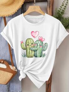 Two Smiling Cacti Embracing With Pink Hearts Symbolize Joyful Love And Sincere Union In A Tender Desert Landscape. This Comfortable Women's Casual T-Shirt Is Ideal For Relaxed Days And Happy Moments. - 白色 - 查看 1